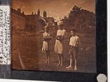 an old photo of a group of people standing in a field