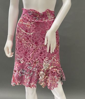 an image of a mannequin wearing a pink skirt with flowers on it