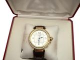 a watch in a box that is open on a white surface
