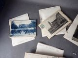 many old postcards on a table with writing on them