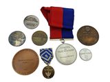 many medals and medals on a white surface