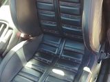 a picture of the inside of a car with black seats