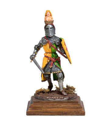 a figurine of a knight with a sword and shield