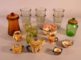 many different types of glassware sitting on a table
