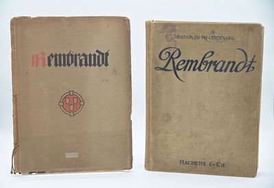 an old book sitting on top of a table next to another book