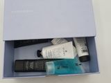 the contents of a blue box containing a lot of beauty products