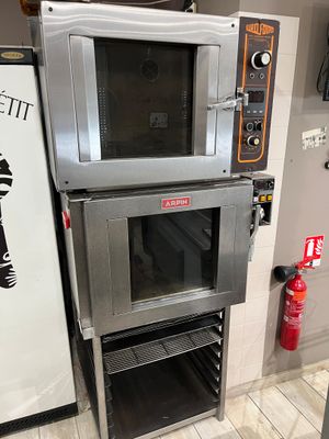 two ovens stacked on top of each other in a kitchen