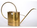 an old brass watering can with a metal handle