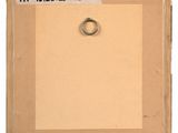 an old picture of a ring on a piece of cardboard