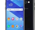 a close up of a black samsung galaxy j2 smartphone