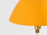 a yellow table lamp with a wooden base and a yellow shade