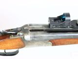 a close up of a rifle with a gun on it
