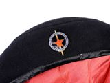 a red jacket with a black hat and a red jacket with a star on it