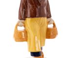 an image of a figurine of a man holding two buckets
