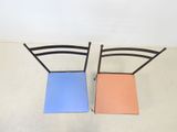 two chairs sitting next to each other on the floor