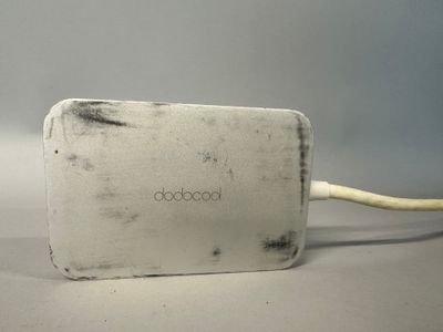 a white box with a white cord attached to it