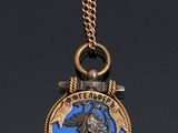 a close up of a necklace with an anchor on it