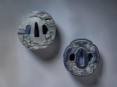 two small metal objects that are on a table