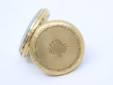 an image of a close up of a gold pocket watch