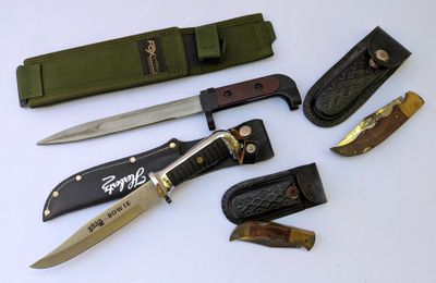five different types of knives on a white surface
