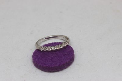 a ring that is sitting on top of a purple object