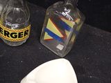 many different types of glass bottles on the table