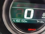 a close up of a car ' s dashboard with a speedometer