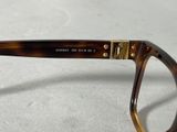 the glasses are made out of tortoises and have gold accents