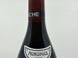 a bottle of wine that is sitting on a table