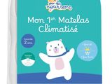 a baby mattress with a white bear on top of it