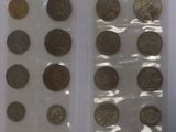 two bags of coins sitting on top of a table next to each other