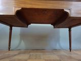 a wooden table with a drawer on top of it