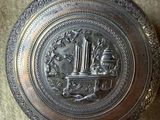 a silver box with a design on it on a table
