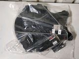 a plastic bag with a black jacket on top of it