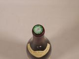 a bottle of wine that is sitting on a table
