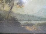 une photo d'un tableau représentant un paysage accroché au mur