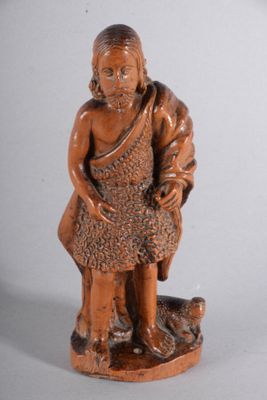 l'image d'une statue d'un homme assis sur un rocher