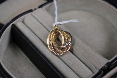 a ring in a ring case with a white string