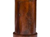 a small wooden table with a marble top on it