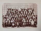 an old photo of a group of people posing for a picture