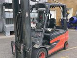 a forklift truck that is parked in a parking lot