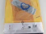 a package of scissors and a pair of scissors on a table