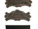 three metal signs are shown on a white background