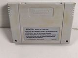 a close up of a nintendo game on a white surface