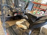 a forklift in the back of a truck in a warehouse