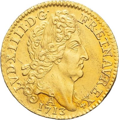a close up of a gold coin with a woman ' s head on it