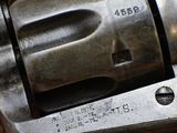 a close up shot of a revolver with the number on it
