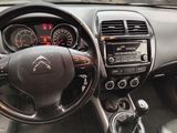 the interior of a car with a steering wheel, dashboard, and dash board