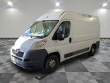 a white van that is parked in a room