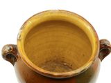 a brown vase with handles on a white background